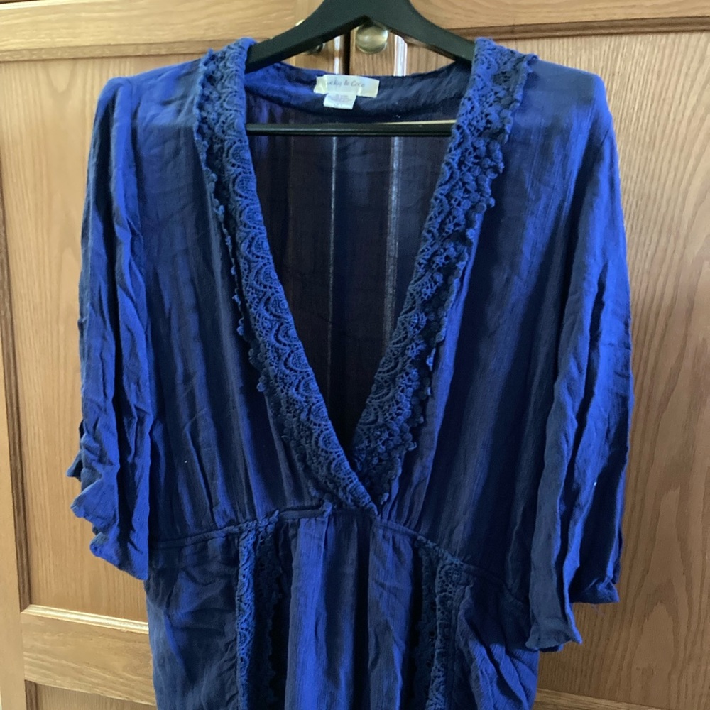 LUCKY & COCO Romper Rich blue with beautiful lace trim. Deep V neckline.